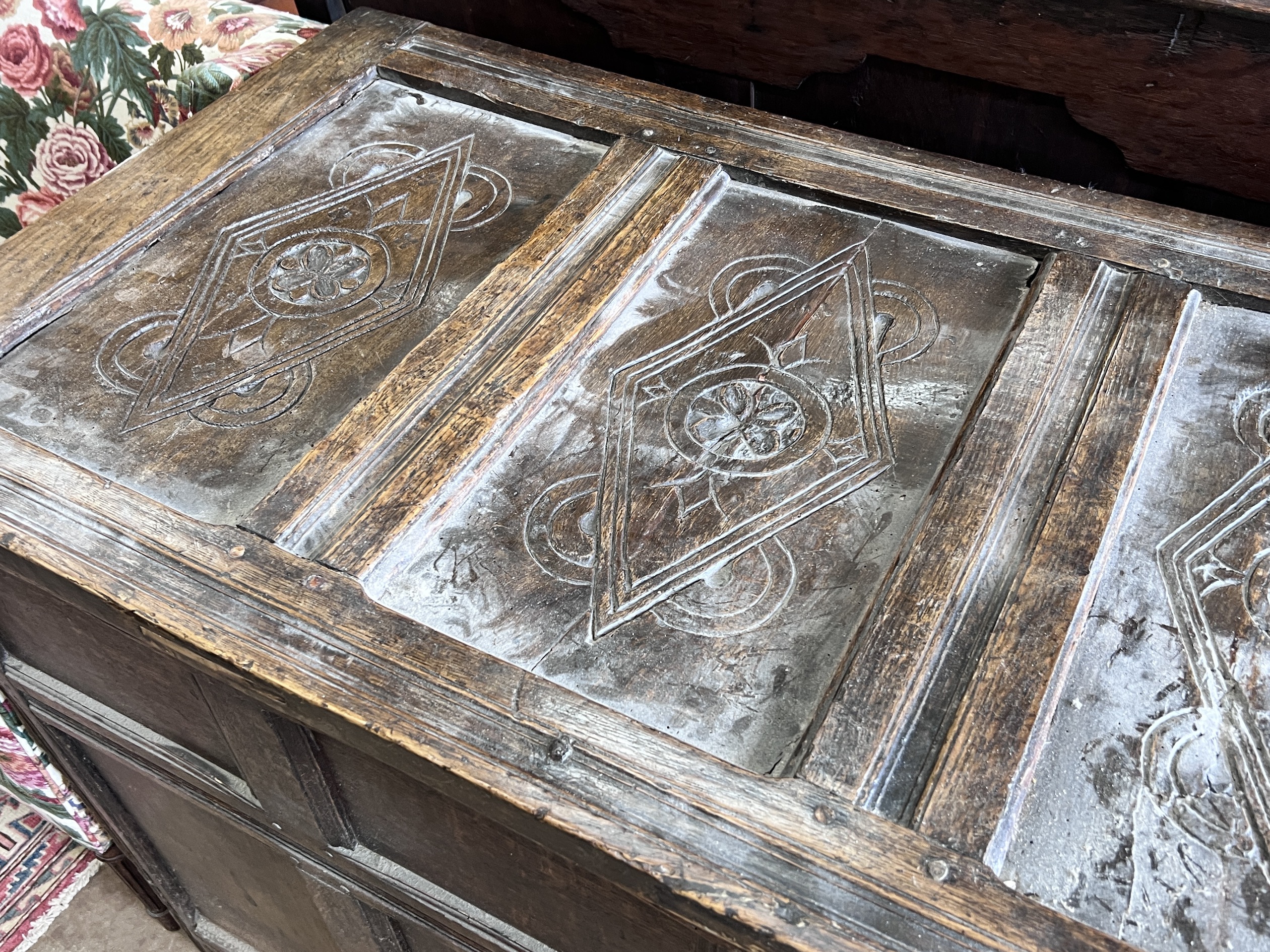 An 18th century panelled oak coffer, length 140cm, depth 61cm, height 92cm